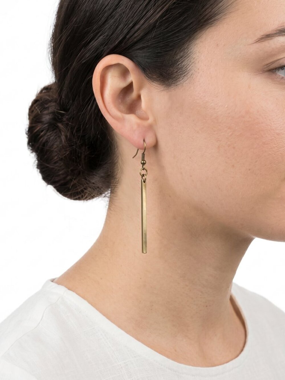 *Pair of long, minimalist gold-toned drop earrings
